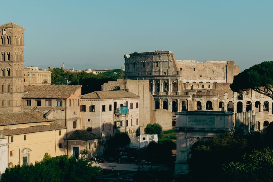 Discover the ancient Colosseum and surrounding architecture in Rome, capturing the essence of historic Italy.