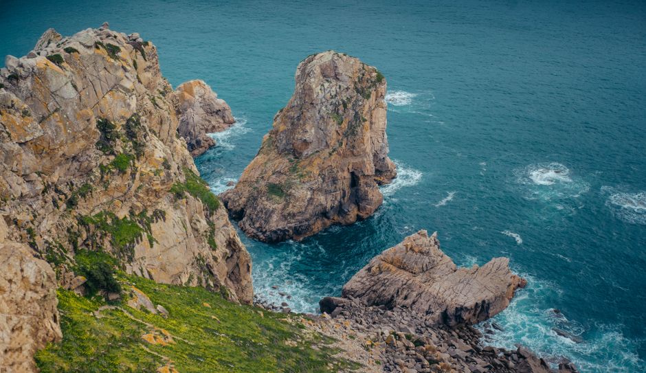 Majestic cliffs and vibrant sea waves at Pointe de Pen Hir, Brittany, France.
